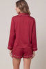 Woven satin long sleeve top and shorts pajama set with contrast piping detail and pockets