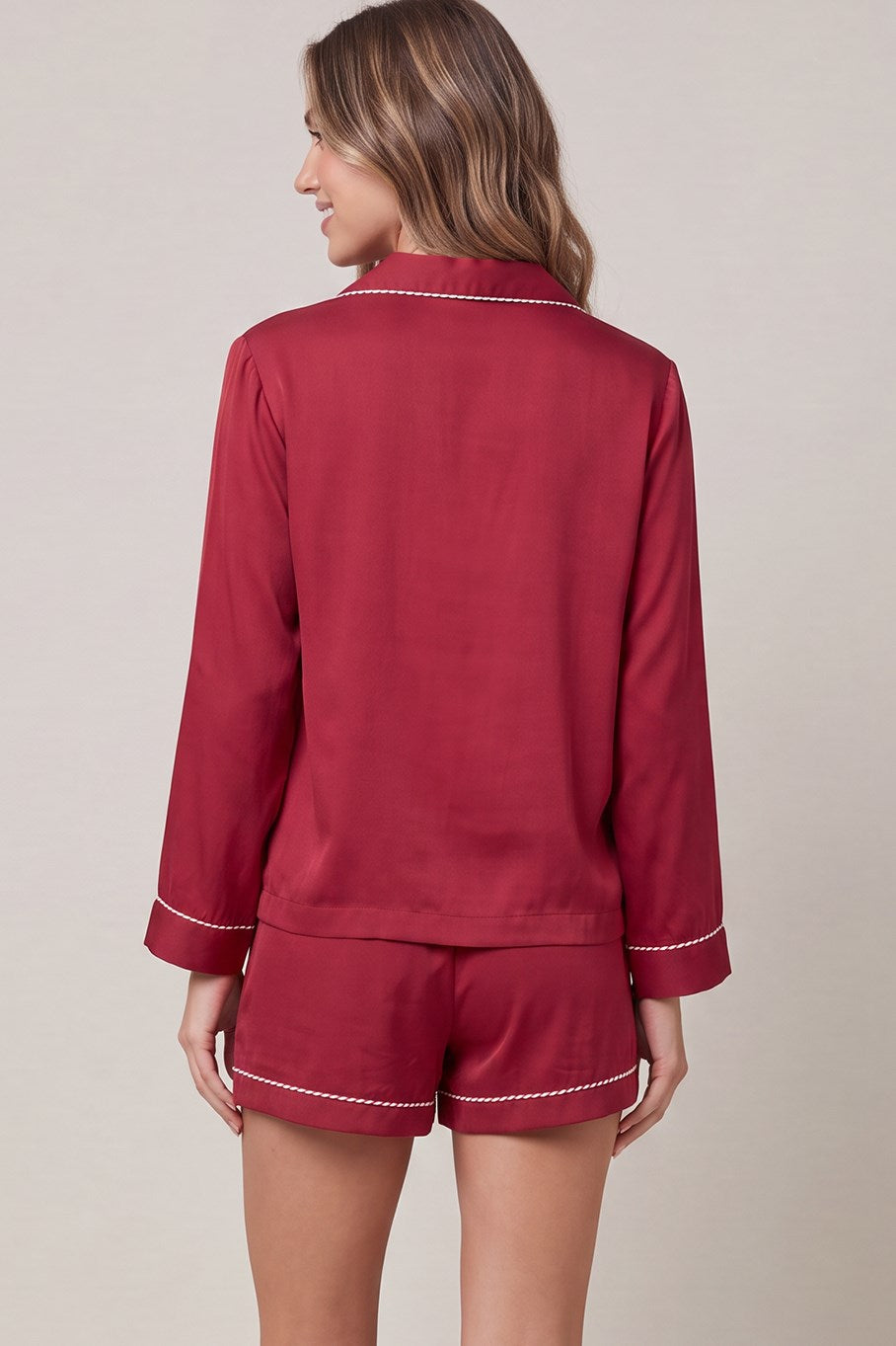 Woven satin long sleeve top and shorts pajama set with contrast piping detail and pockets