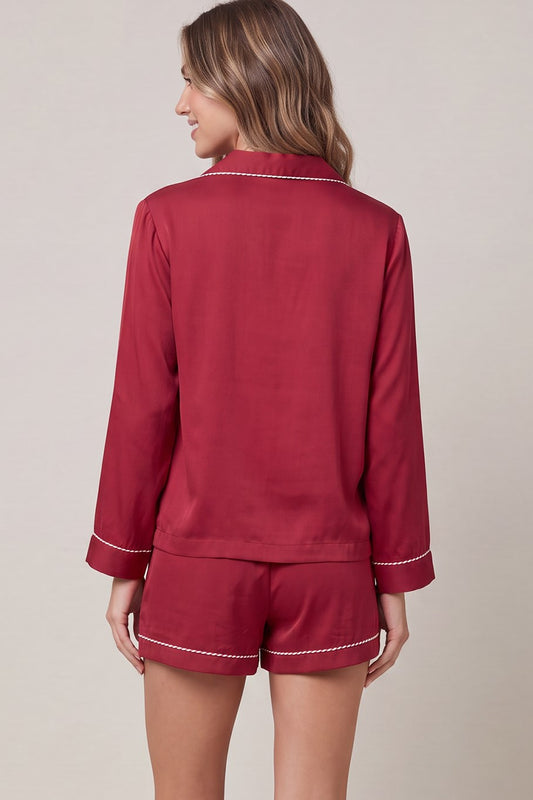 Woven satin long sleeve top and shorts pajama set with contrast piping detail and pockets