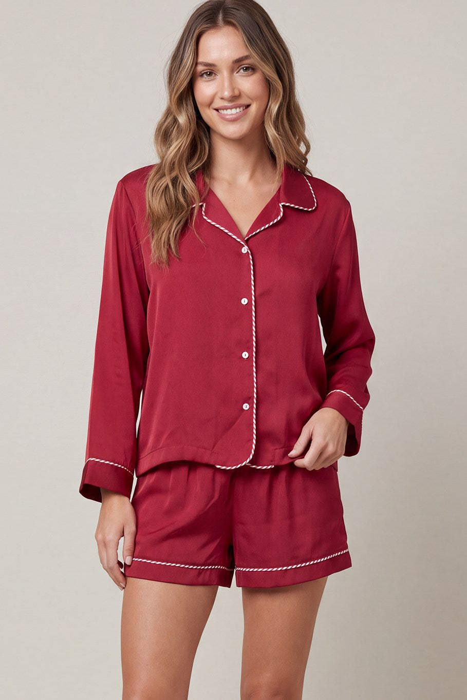 Woven satin long sleeve top and shorts pajama set with contrast piping detail and pockets