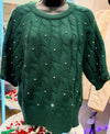 Solid short sleeve sweater knit top featuring cable knit with pearl accents