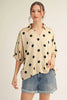 Drop shoulder polka dot satin top with collared neckline.