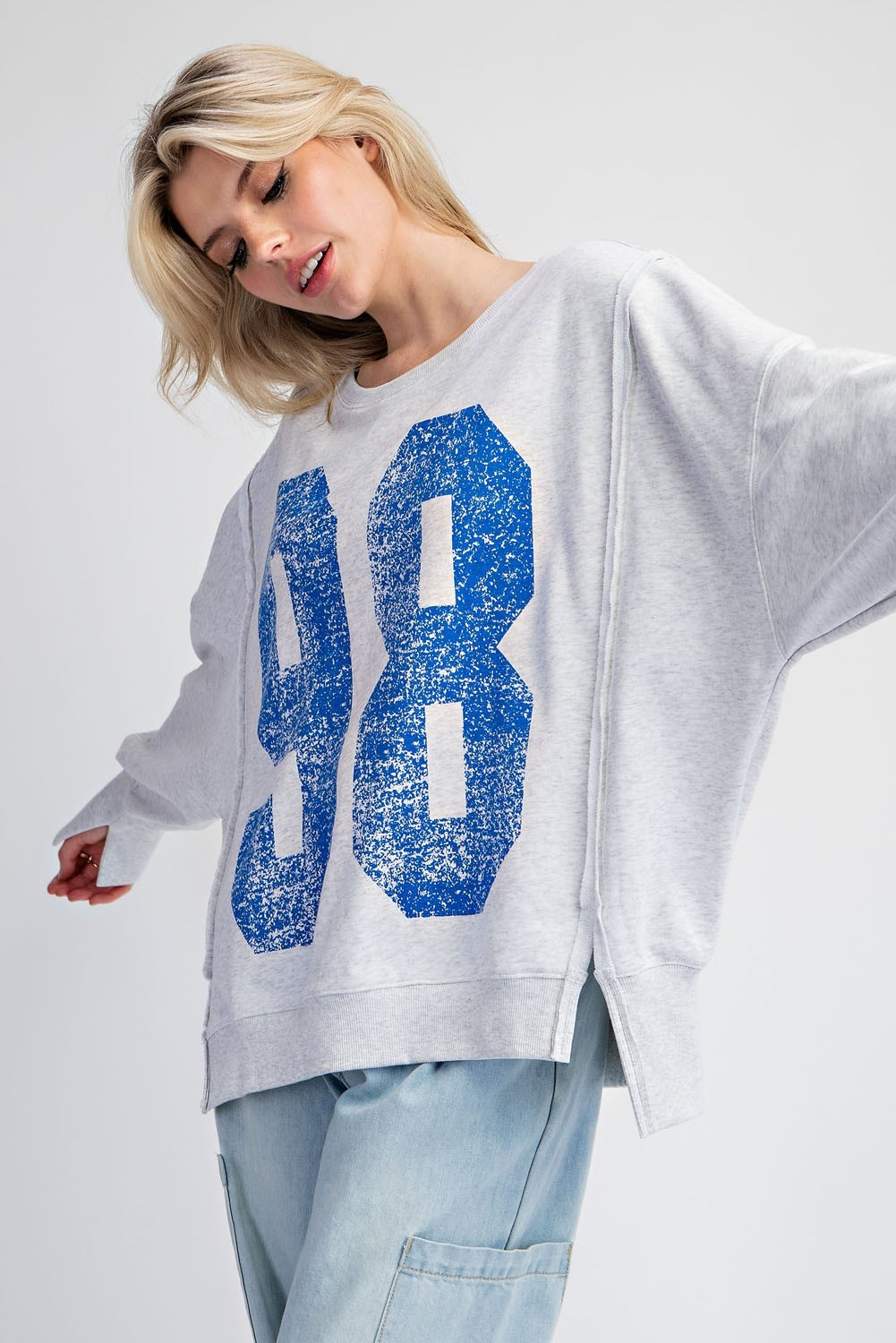 Faded varsity print long sleeve pullover top