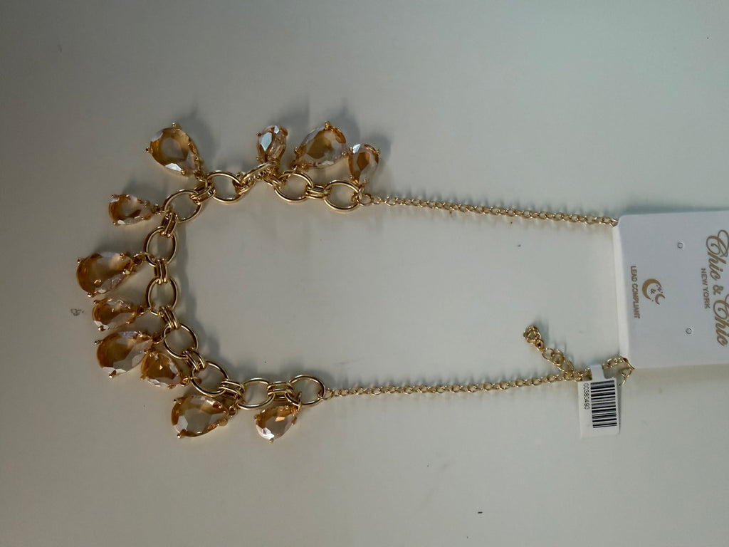 Golden stones on golden loops necklace