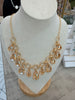 Golden stones on golden loops necklace