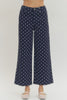 Polka dot wide leg pants featuring button and zip-fly closure at front