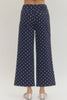 Polka dot wide leg pants featuring button and zip-fly closure at front