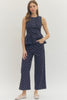 Polka dot wide leg pants featuring button and zip-fly closure at front