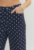 Polka dot wide leg pants featuring button and zip-fly closure at front