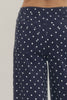 Polka dot wide leg pants featuring button and zip-fly closure at front