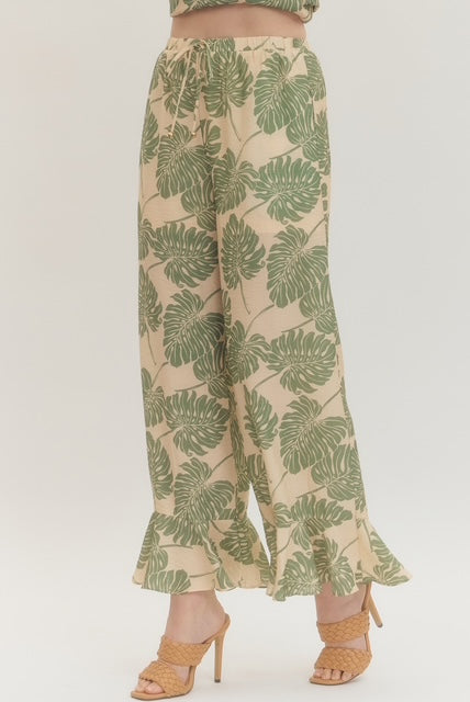 Botanical print wide leg pants featuring elasticated waistband with drawstring tie