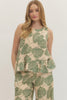 Botanical print sleeveless top featuring ruffle hem detail