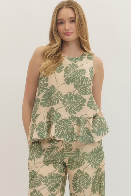 Botanical print sleeveless top featuring ruffle hem detail