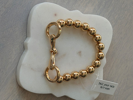 Gold colored beaded horse-bit bracelet