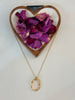 Delicate long link chain with abstract oval pendant
