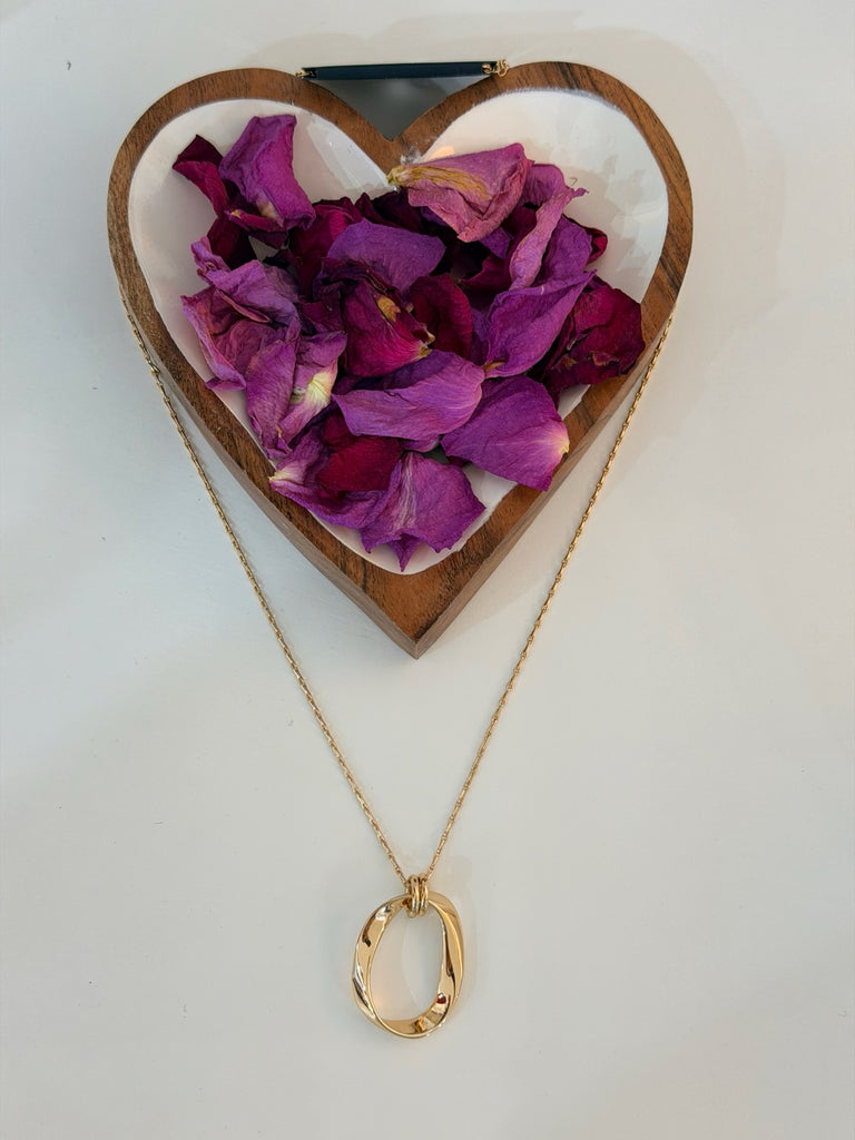 Delicate long link chain with abstract oval pendant