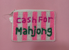 A small rectangular zippered pouch with pink and white vertical stripes, featuring the embroidered text 'cash FOR Mahjong' in pink and green on a pink background.