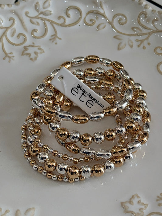Water resistant gold and silver horsebit beaded bracelet set