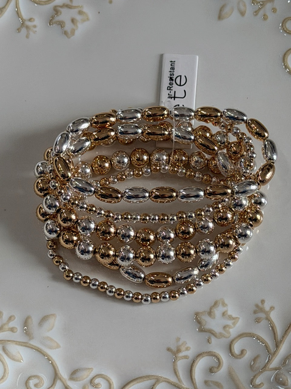 Water resistant gold and silver horsebit beaded bracelet set
