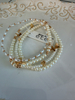 Water resistant rods, beads, and pearls with hearts and cross stacked bracelet