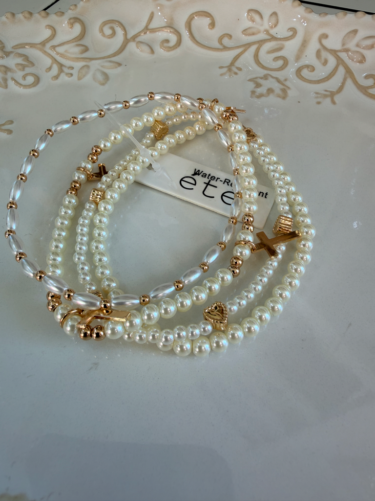 Water resistant rods, beads, and pearls with hearts and cross stacked bracelet