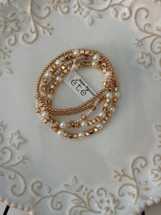 Water resistant gold beads and pearl and square beads stacked bracelet