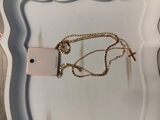 Layered chain and disc necklace with faux diamond cross