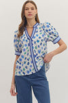Floral print short puff sleeve top featuring contrast striped binding along V-neck