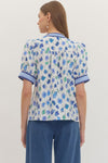 Floral print short puff sleeve top featuring contrast striped binding along V-neck