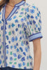 Floral print short puff sleeve top featuring contrast striped binding along V-neck