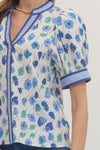 Floral print short puff sleeve top featuring contrast striped binding along V-neck