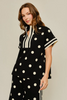 Drop shoulder front zip up polka dot top and bottom with color rib band accent, mock neck