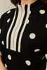 Drop shoulder front zip up polka dot top and bottom with color rib band accent, mock neck