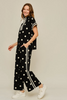 Drop shoulder front zip up polka dot top and bottom with color rib band accent, mock neck
