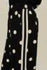 Drop shoulder front zip up polka dot top and bottom with color rib band accent, mock neck