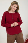 Ribbed henley long sleeve exposed seam knit top