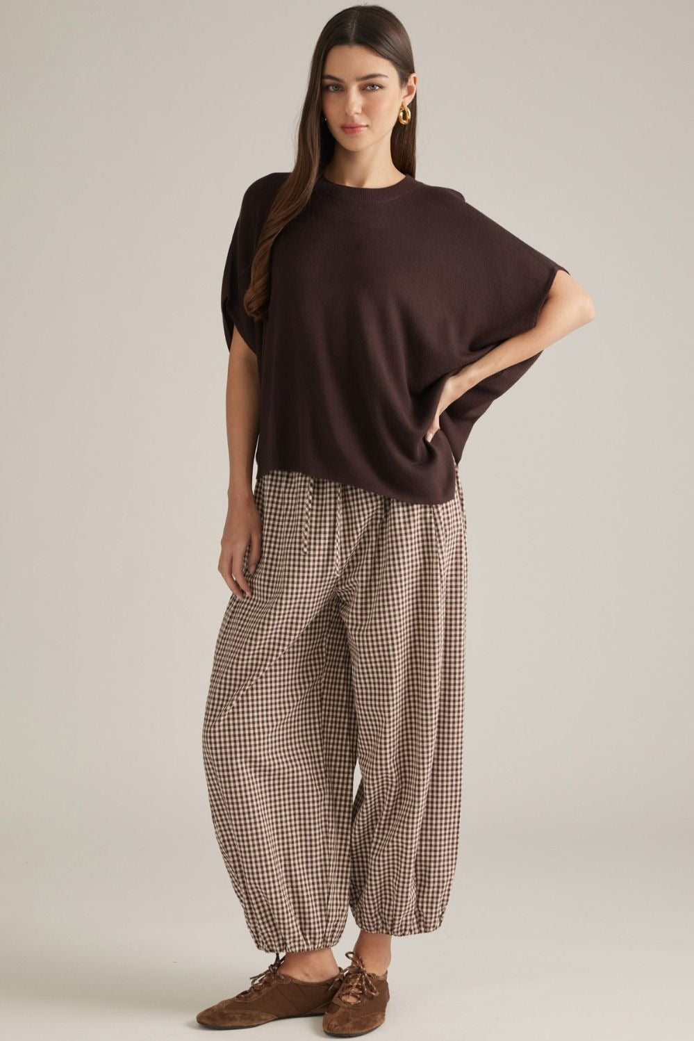Solid short poncho sleeve sweater top with a round neckline