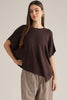 Solid short poncho sleeve sweater top with a round neckline