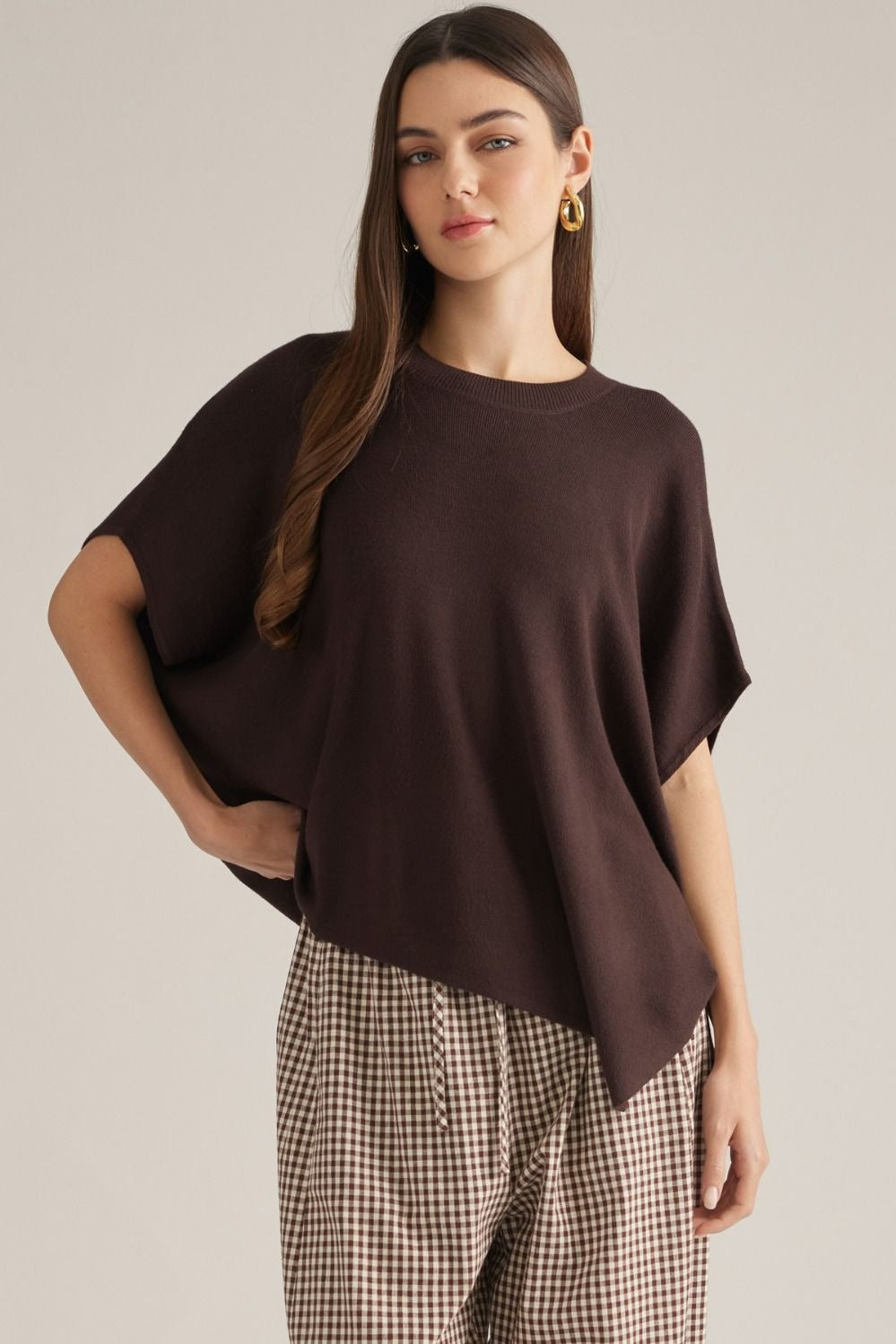 Solid short poncho sleeve sweater top with a round neckline