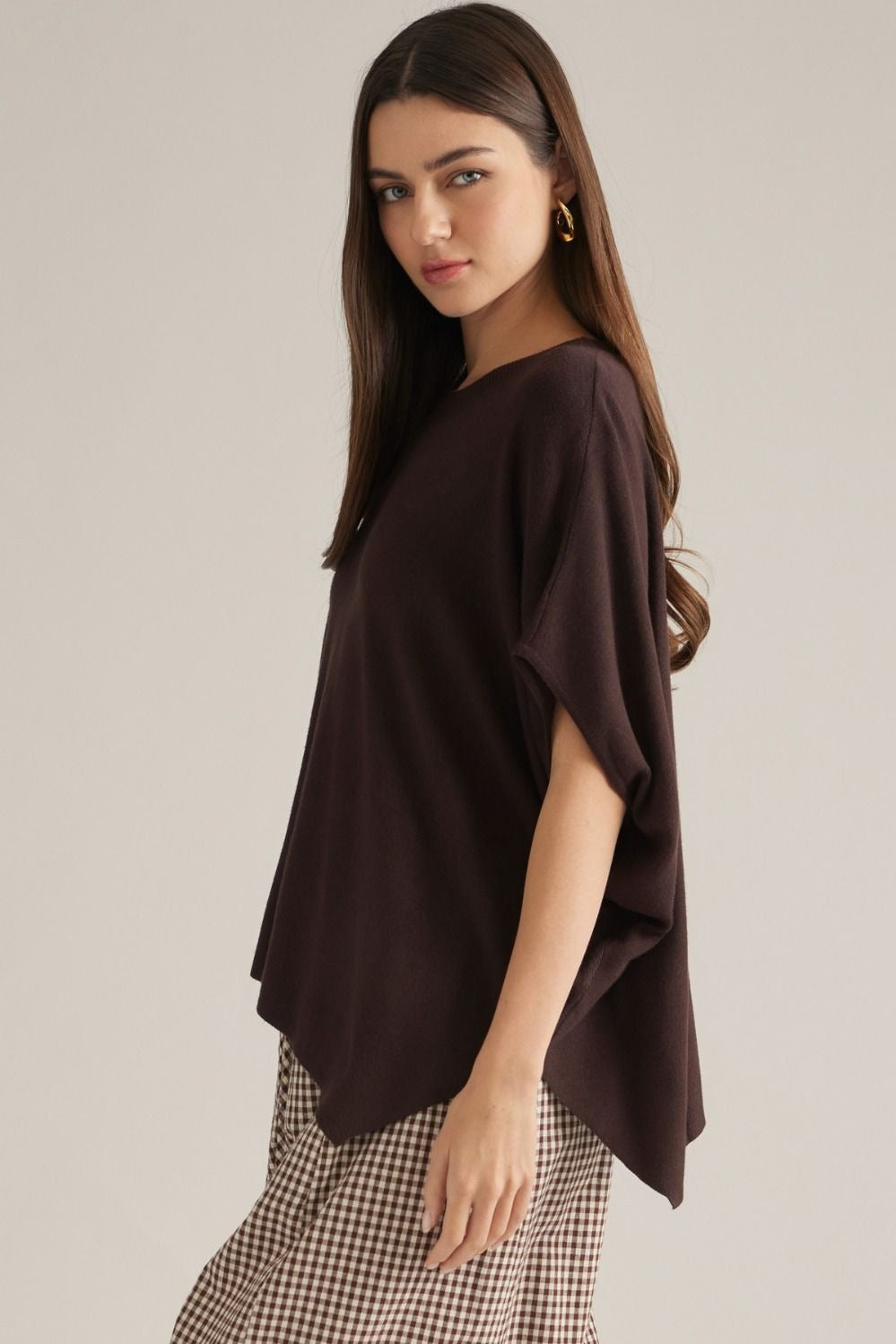 Solid short poncho sleeve sweater top with a round neckline