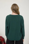 Ribbed henley long sleeve exposed seam knit top