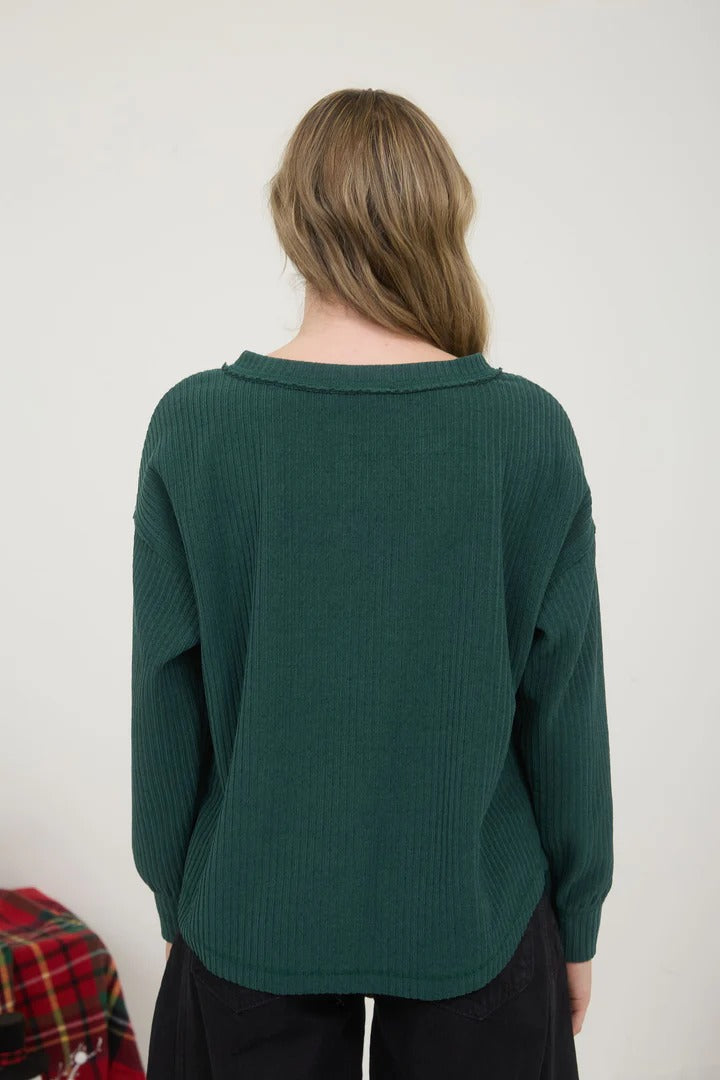 Ribbed henley long sleeve exposed seam knit top