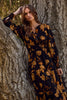 Floral printed tiered maxi dress with elastic waist and buttoned neckline