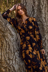 Floral printed tiered maxi dress with elastic waist and buttoned neckline