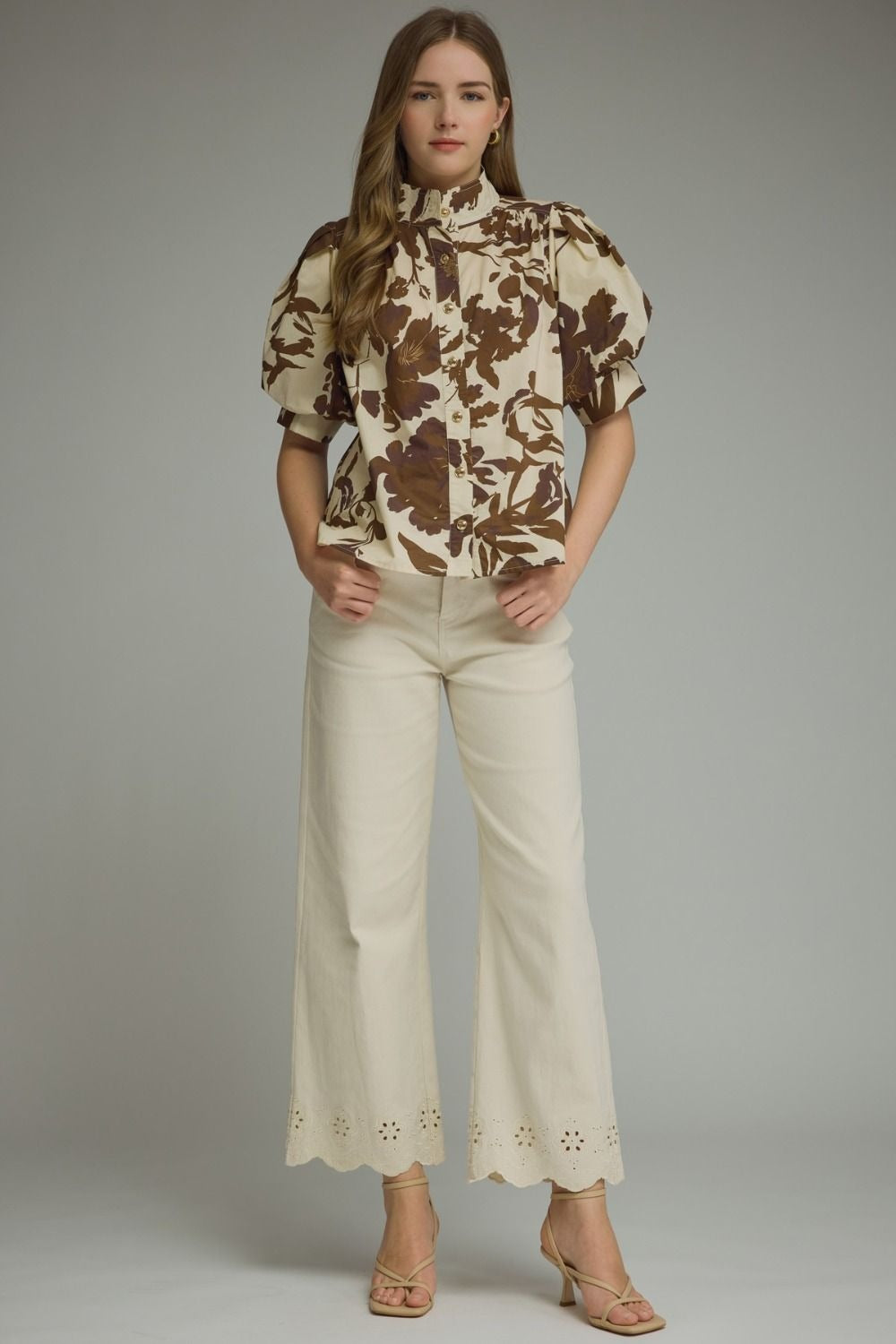 Printed short puff sleeve top featuring button closure at front