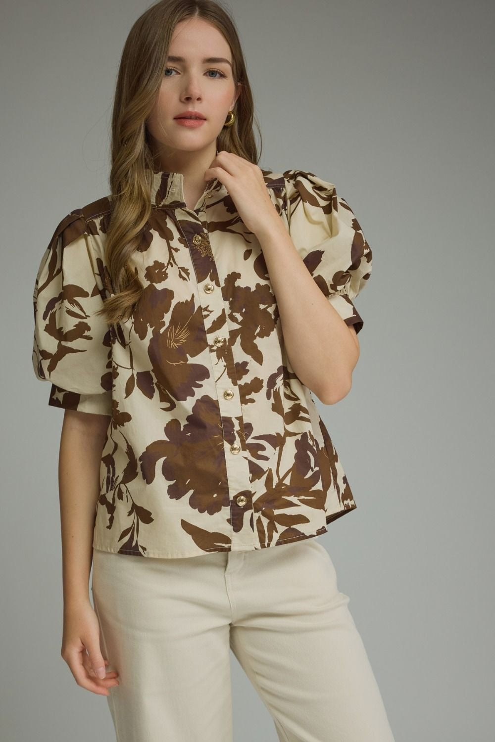 Printed short puff sleeve top featuring button closure at front