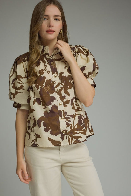 Printed short puff sleeve top featuring button closure at front