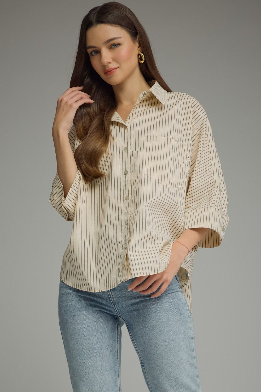 Stripe ¾ sleeve top featuring front pocket detail