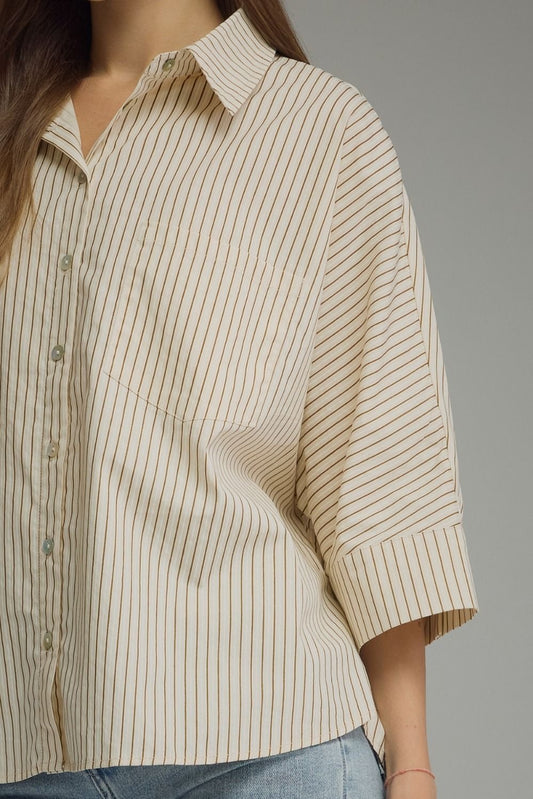 Stripe ¾ sleeve top featuring front pocket detail
