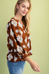 Puff printed v-neck blouse with 3/4 length sleeves and ric-rac trim